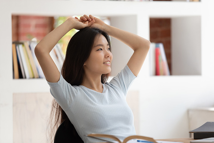 4 Books to Help You Adopt the Entrepreneurial Mindset Calm asian student girl sitting at desk resting after studying