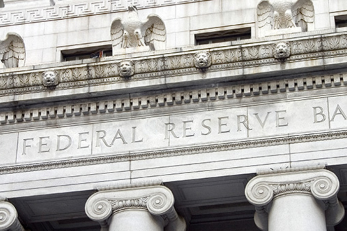 March Madness! Yield Curve Inverts and the Fed Throws in the Towel The facade of the Federal Reserve Bank.