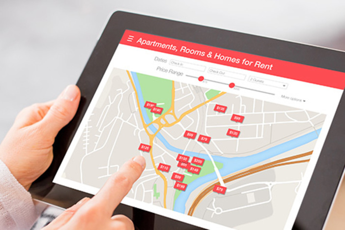 Summer 2019 Rent Report: Where Pricing Is Heating Up, Fizzling Out Person looking for places to stay on digital tablet