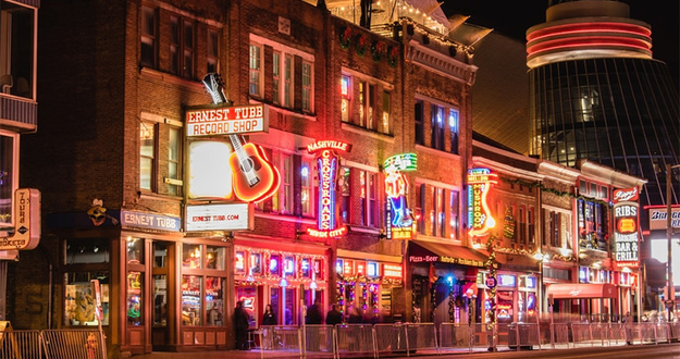 BP Con 2019: What’s the Deal and How Will It Transform Your Business? downtown Nashville, Tennessee at night bars lit up with neon signs