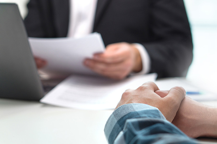 How to Get a Commercial Loan in 7 Simple Steps People having meeting in office. Boss with a job applicant in in
