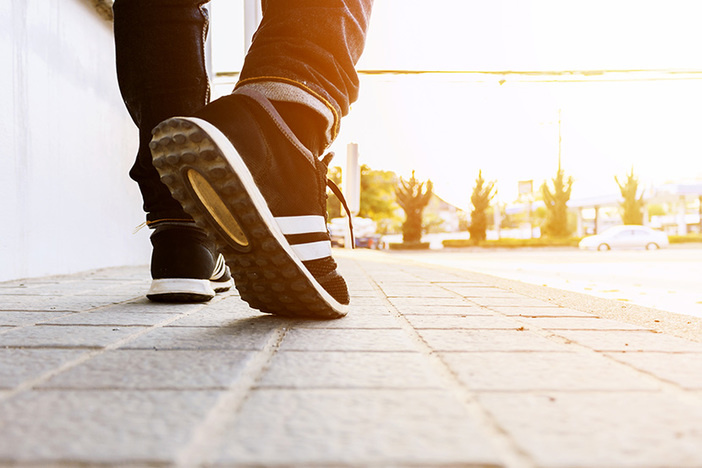 I Did My First Deal in Less Than 45 Days for Under $2,500—Here’s How hipster walking on the street with soft-focus in the background. over light and film colors tone