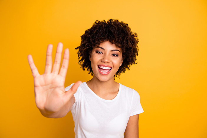 5 Principles for Investing in Uncertain Times Close up photo beautiful amazed she her dark skin lady glad arms hands five fingers raised show countable uncountable things lesson wearing casual white t-shirt isolated yellow bright background.