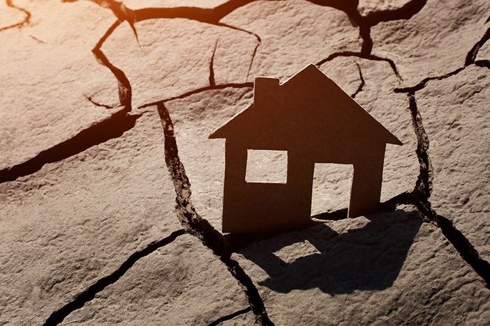 Facing Foreclosure? Read This 5-Step Survival Guide Paper house on cracked earth, crisis concept