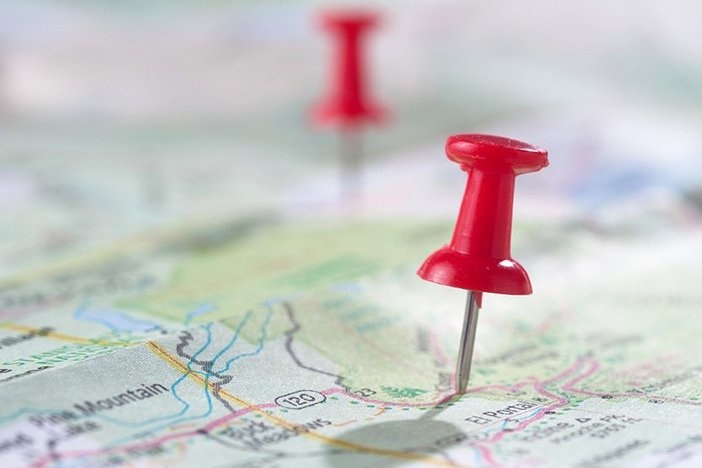 The Rise of Remote Real Estate Investing (and How to Get in on the Action) Travel concept with red pushpin