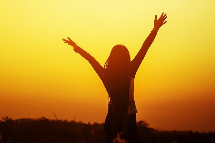 Why Some People Will Never Succeed (& Others Always Will) Happy woman raised hands up on the sky at sunset