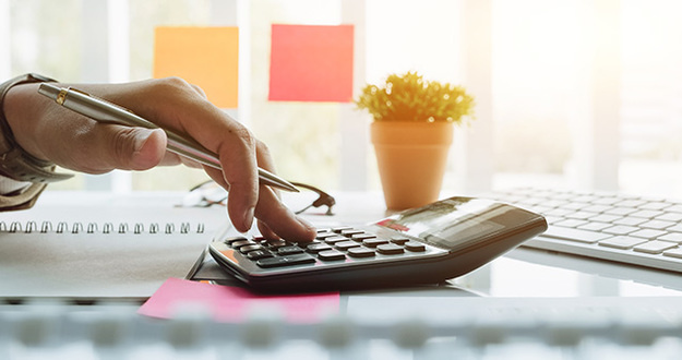 6 Simple Ways to Cut Costs in Your Real Estate Business Close up view of bookkeeper or financial inspector hands making report, calculating or checking balance. Home finances, investment, economy, saving money or insurance concept