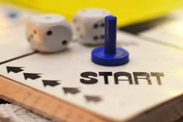 5 Achievable Tasks for Real Estate Newbies Feeling Lost & Overwhelmed game board with dice and game piece at start