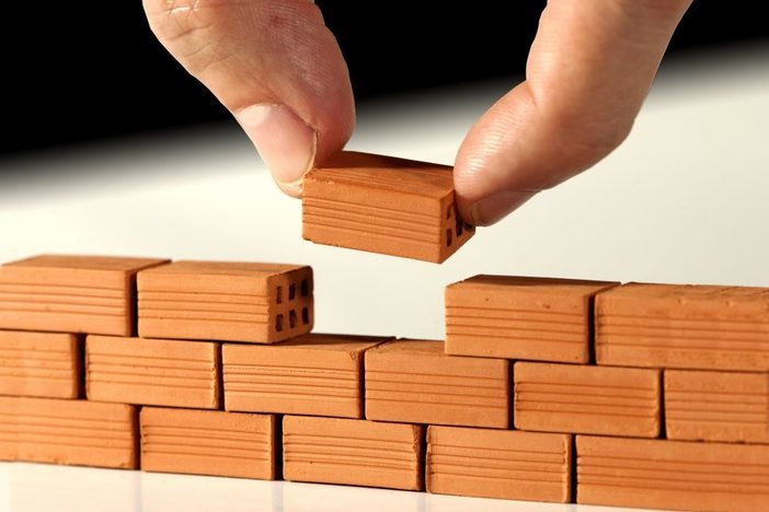 The Investor’s Mini-Guide to Scaling Up to a Real Estate Empire scale-business